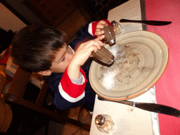 Max playing with pepper and salt at the Paquita Bello restaurant