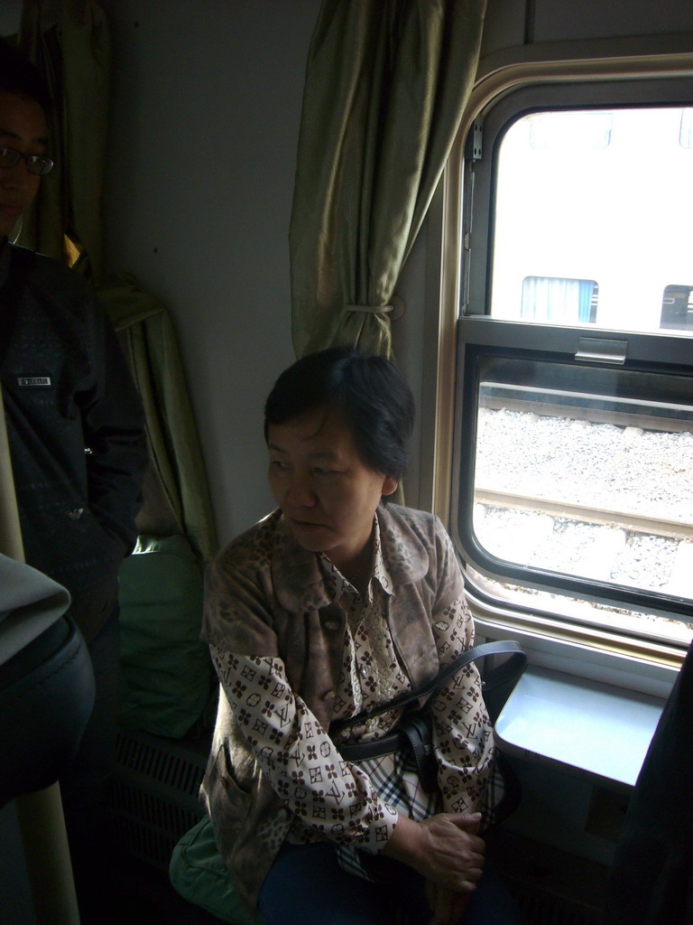 Miaomiao`s mother in the sleeper train from Kunming to Dali