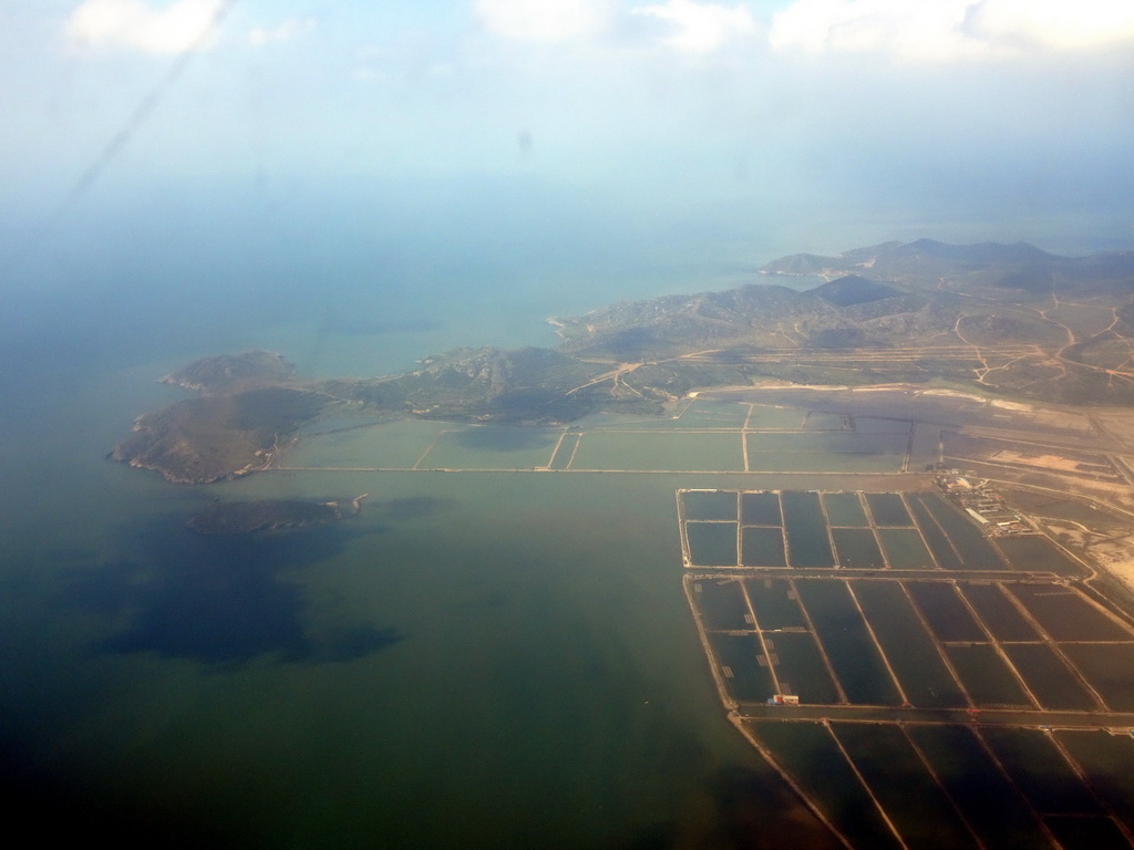 The Hantuozi island and the coastline on the west side of the city, viewed from the airplane from Beijing