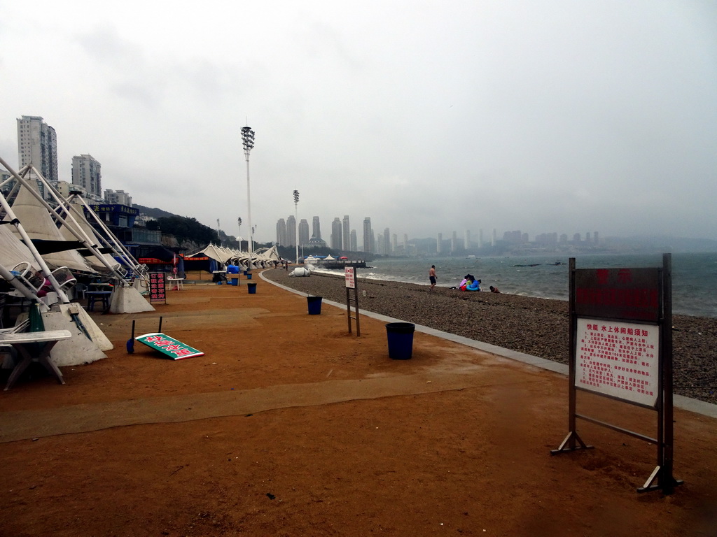 The beach at Binhai Road and skyscrapers at the Xihaitun neighbourhood