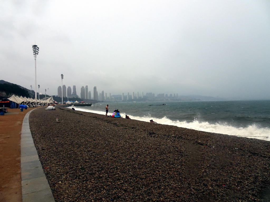 The beach at Binhai Road and skyscrapers at the Xihaitun neighbourhood