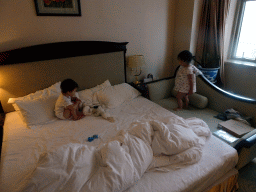 Max and his cousin in our first bedroom at the New Sea View International Hotel