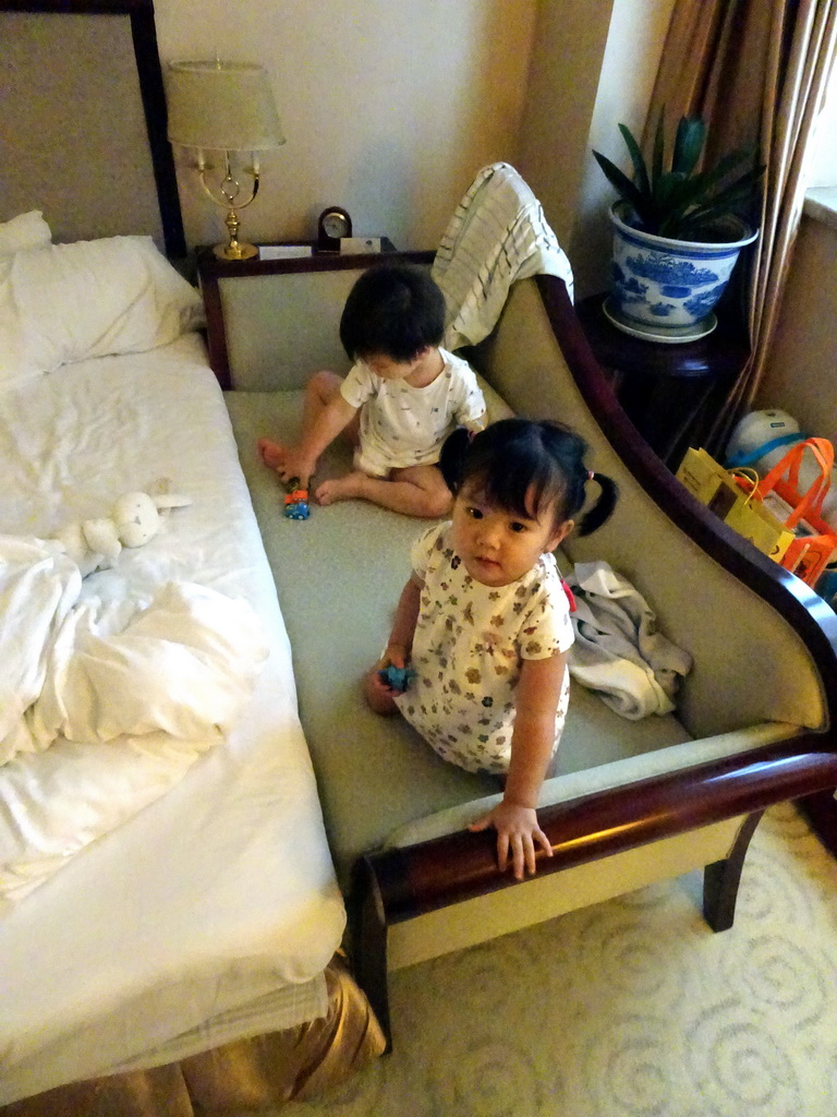 Max and his cousin in our first bedroom at the New Sea View International Hotel