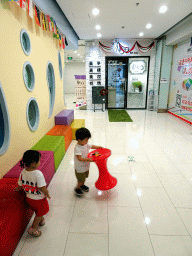 Max and his cousin in a shopping mall at Fushun Street