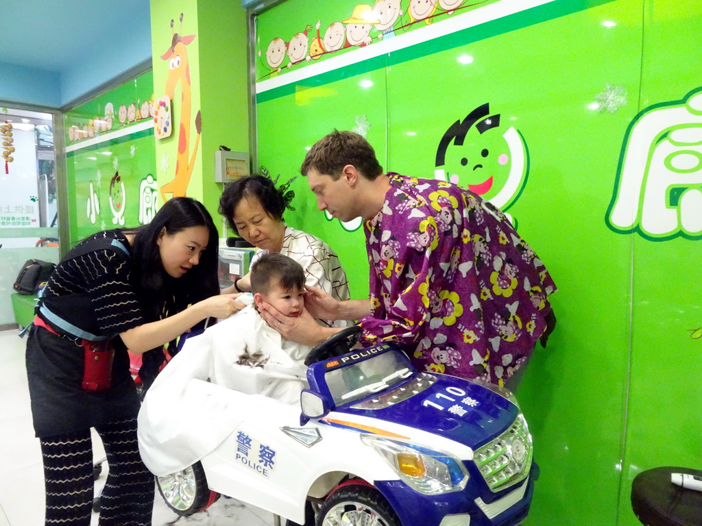 Tim, Max and Miaomiao`s mother at the barber in a shopping mall at Fushun Street