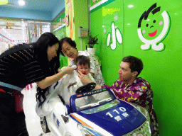 Tim, Max and Miaomiao`s mother at the barber in a shopping mall at Fushun Street