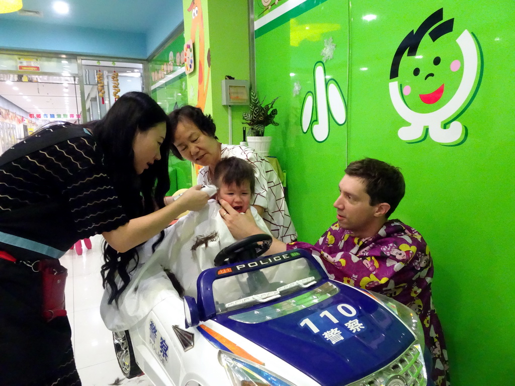 Tim, Max and Miaomiao`s mother at the barber in a shopping mall at Fushun Street