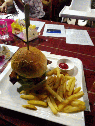 Burger and fries at the Tribes restaurant in a shopping mall at Fushun Street