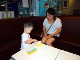 Miaomiao and Max having ice cream at the Tribes restaurant in a shopping mall at Fushun Street