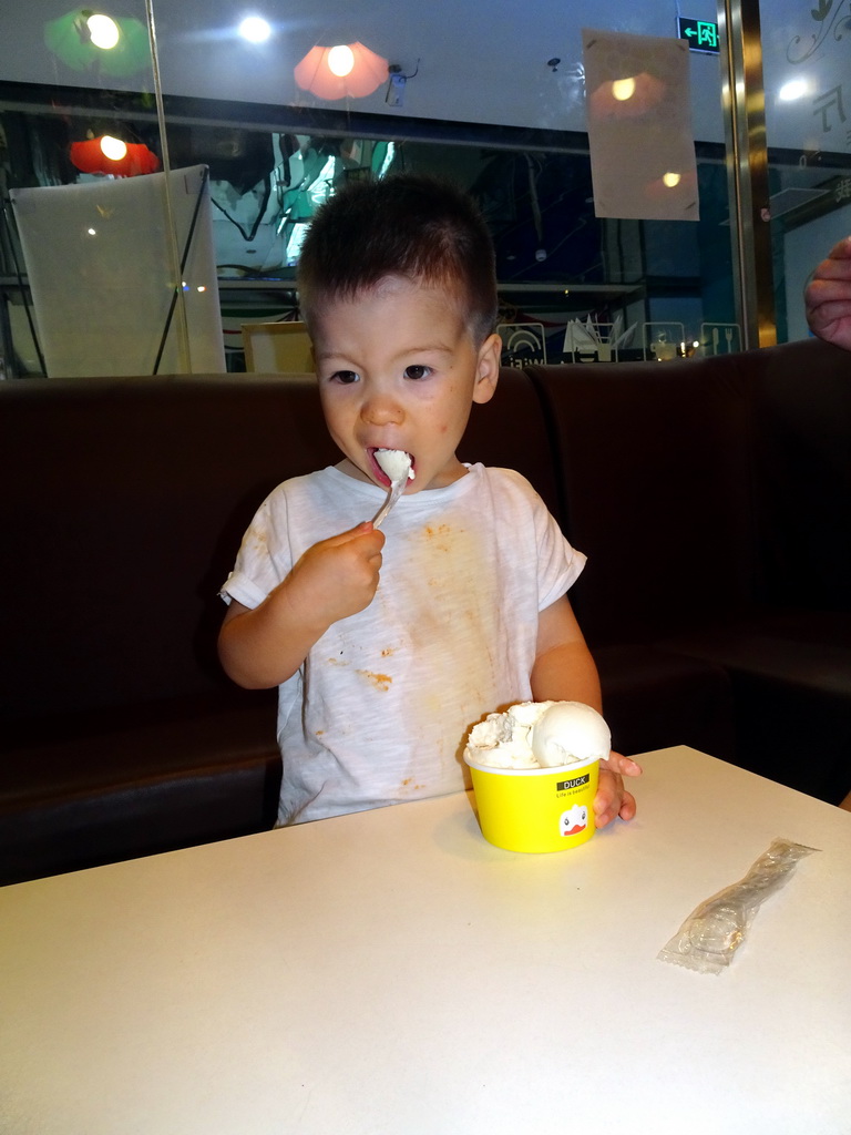 Max having ice cream at the Tribes restaurant in a shopping mall at Fushun Street