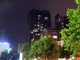 Buildings and tress at Fushun Street, by night