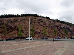 Rock with dinosaur skeletons at Binhai Road
