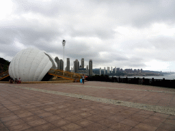 Shell-shaped monument at a square at Binhai Road, and skyscrapers at the Xihaitun neighbourhood