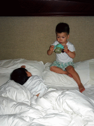 Max and his cousin in our first bedroom at the New Sea View International Hotel