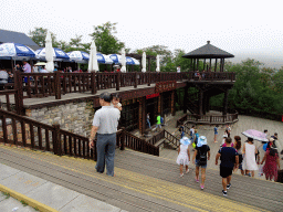 Miaomiao`s father and niece at the entrance of the Dalian Jinshitan Coastal National Geopark