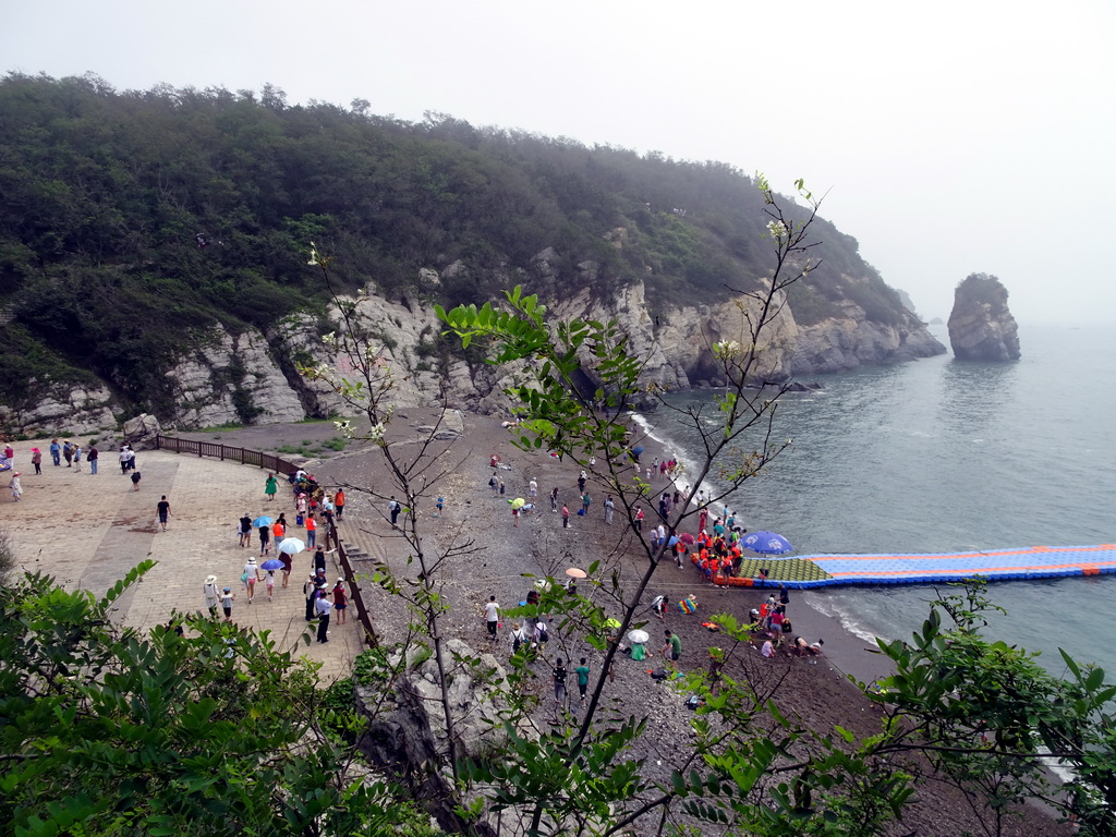 Beach, pier and rock at the Dalian Jinshitan Coastal National Geopark