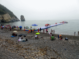 Beach, pier and rock at the Dalian Jinshitan Coastal National Geopark