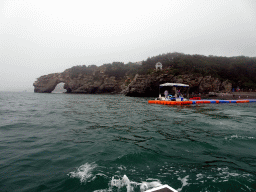 Rock gate and pavilion at the Dalian Jinshitan Coastal National Geopark, viewed from the ferry