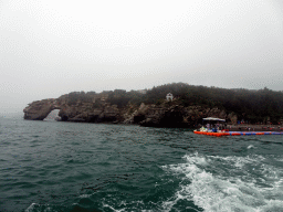 Rock gate and pavilion at the Dalian Jinshitan Coastal National Geopark, viewed from the ferry