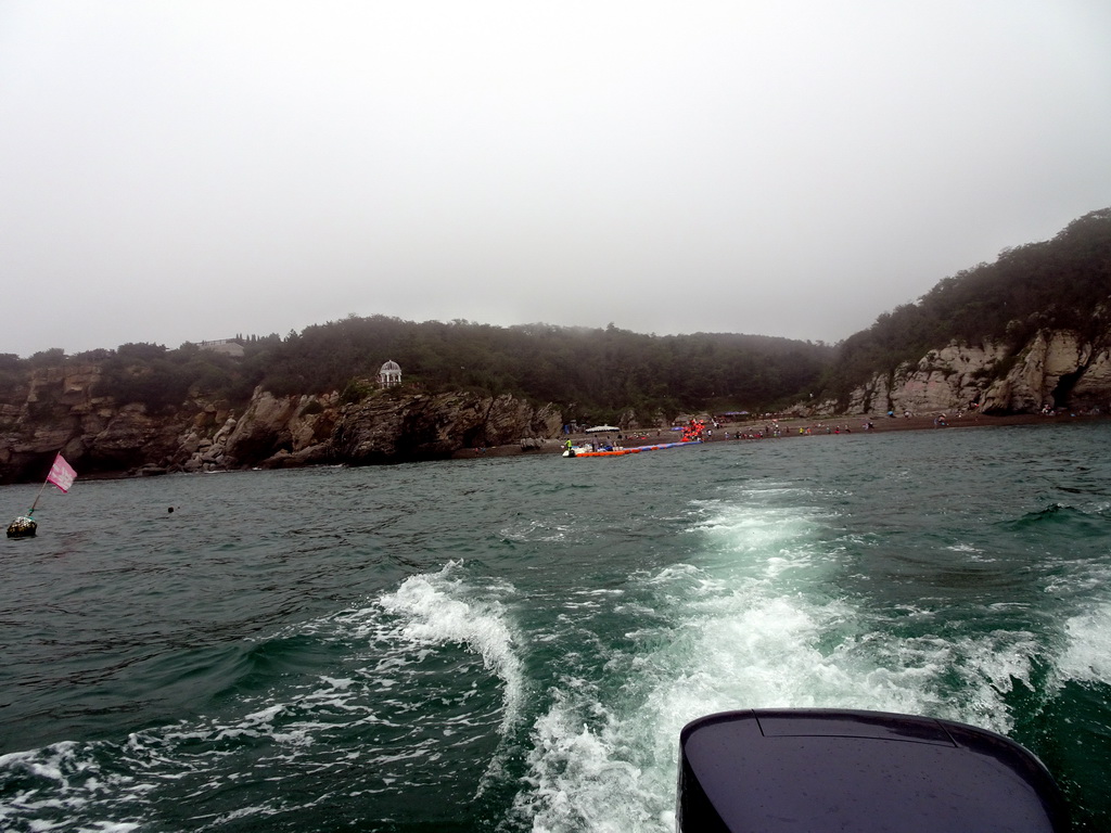 Pavilion and beach at the Dalian Jinshitan Coastal National Geopark, viewed from the ferry