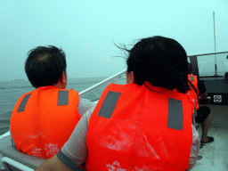 Miaomiao and her father on the ferry at the Dalian Jinshitan Coastal National Geopark