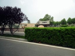 Building and rock with inscription at Central Street, viewed from the taxi