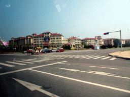 Buildings and horse and carriage at Jinshi Road, viewed from the taxi