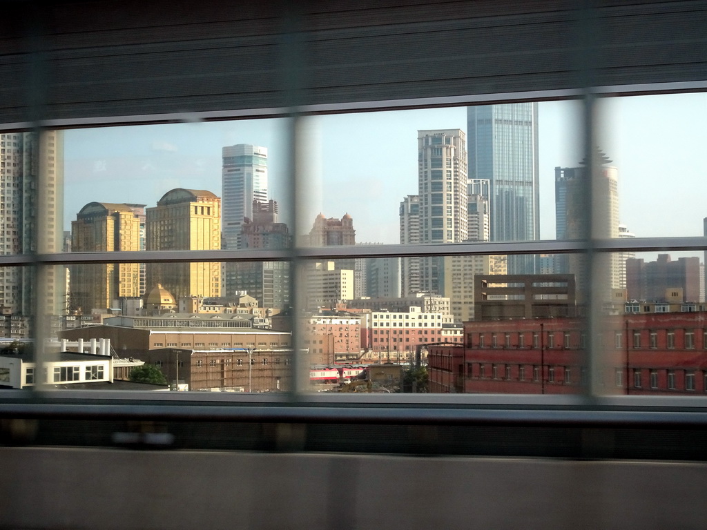 Skyscrapers in the city center, viewed from the taxi at Shugang Road