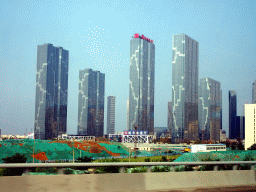 dalian_343 - 294 kb - 1024x768 - Skyscrapers in the city center, viewed from the taxi at Shugang Road Skyscrapers in the city center, viewed from the taxi at Shugang Road