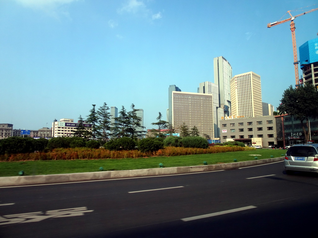 Skyscrapers in the city center, viewed from the taxi at Shugang Road