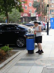 Dog on a trash can at Dandong Street