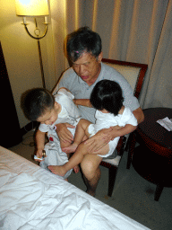 Max with his cousin and grandfather at his grandparents` room at the New Sea View International Hotel