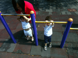 Max with his cousin and aunt at the playground at Haibin Park