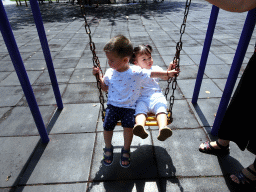 Max with his cousin on the swing at the playground at Haibin Park