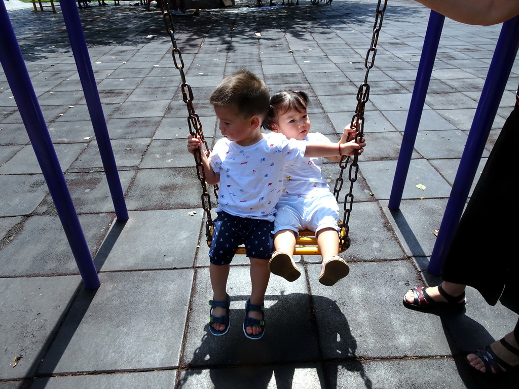 Max with his cousin on the swing at the playground at Haibin Park