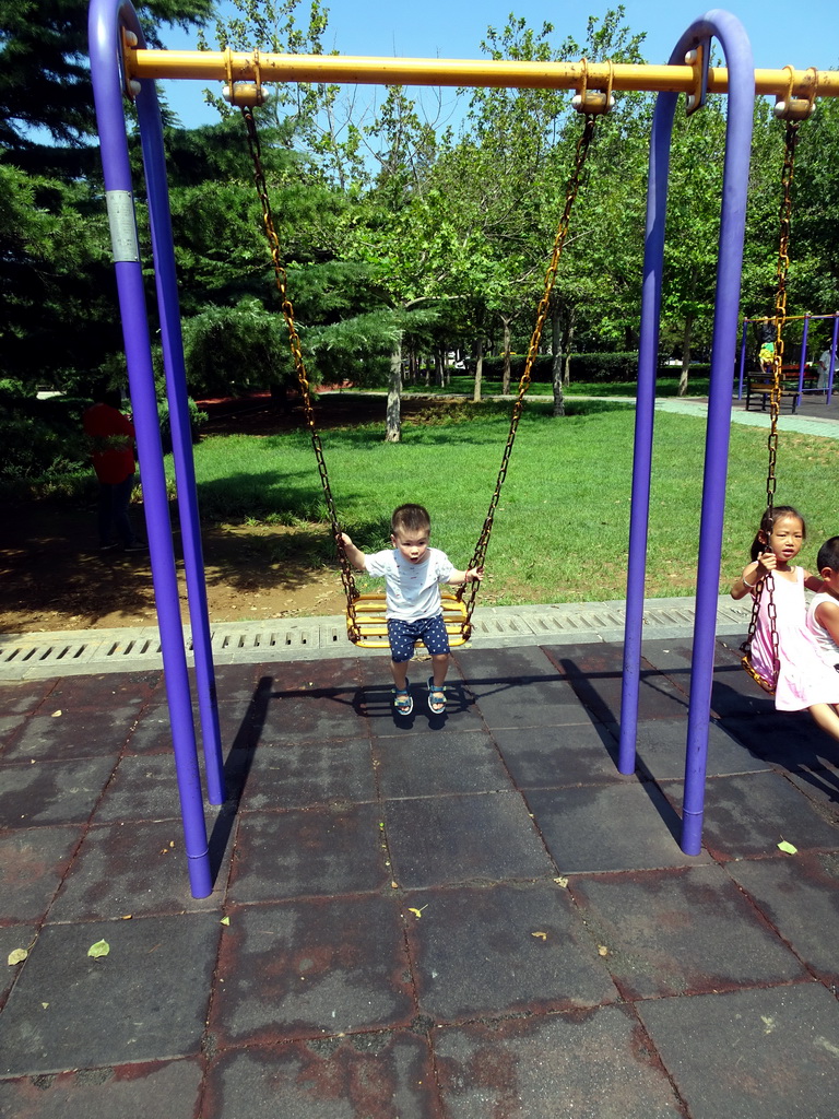 Max on the swing at the playground at Haibin Park