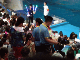 Audience and salesmen in the Main Hall of the Pole Aquarium at the Dalian Laohutan Ocean Park, just before the Water Show