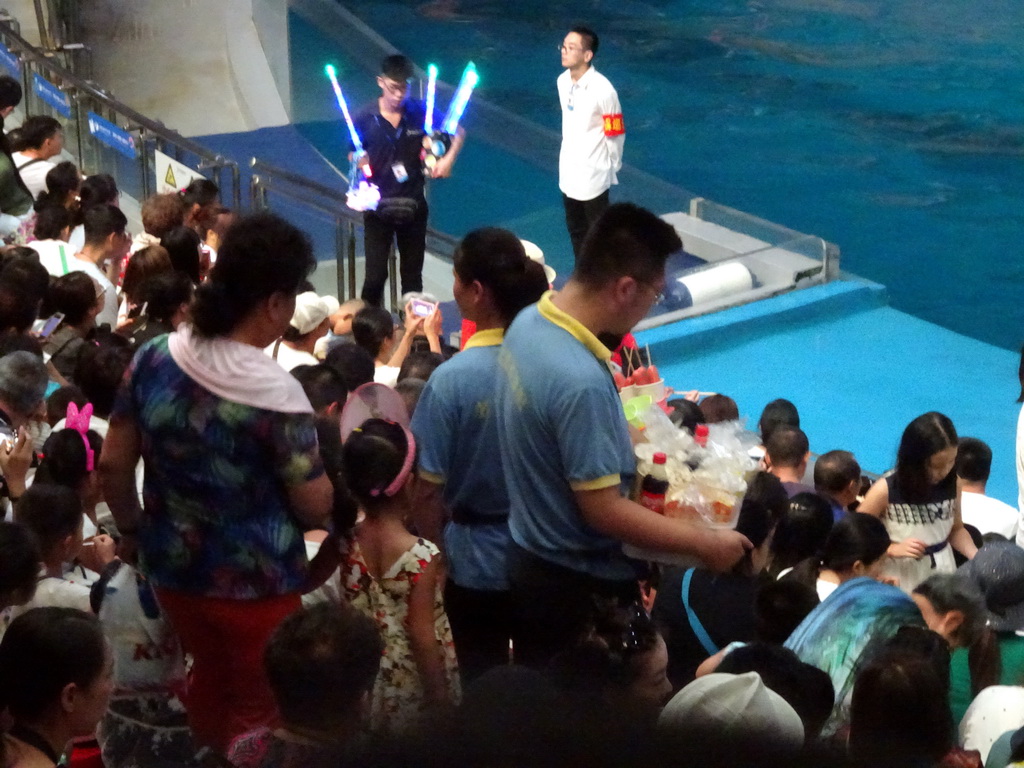 Audience and salesmen in the Main Hall of the Pole Aquarium at the Dalian Laohutan Ocean Park, just before the Water Show