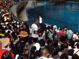 Audience and salesmen in the Main Hall of the Pole Aquarium at the Dalian Laohutan Ocean Park, just before the Water Show