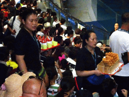 Audience and salesmen in the Main Hall of the Pole Aquarium at the Dalian Laohutan Ocean Park, just before the Water Show