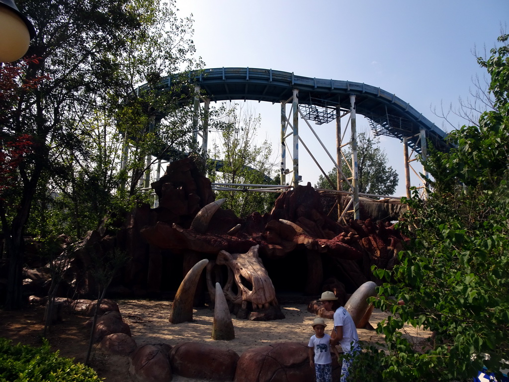 Skull, bones and rollercoaster at the Jurassic Exploration area at the Dalian Laohutan Ocean Park