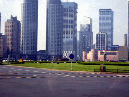 Skyscrapers and the Dalian Xinghai Convention & Exhibition Center at the north side of Xinghai Square, viewed from the taxi on the southeast side