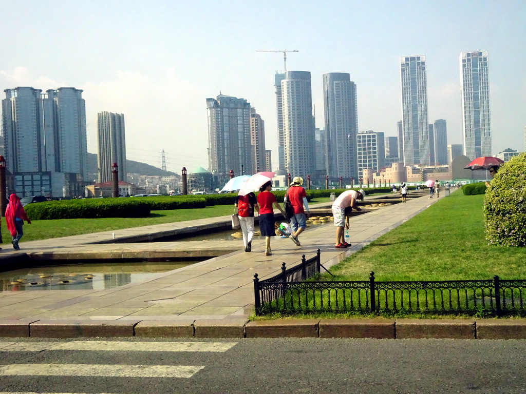 Xinghai Square, with skyscrapers and the Dalian Xinghai Convention & Exhibition Center at the north side, viewed from the taxi on the south side