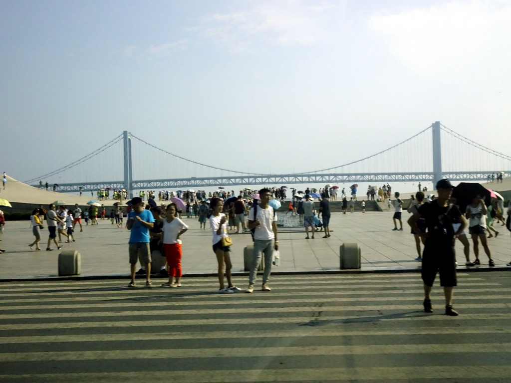 The Dalian Bainian Memorial Chengdiao at the south side of Xinghai Square, and the Xinghai Bay Bridge, viewed from the taxi