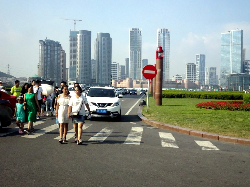 Xinghai Square, with skyscrapers and the Dalian Xinghai Convention & Exhibition Center at the north side, viewed from the taxi on the south side