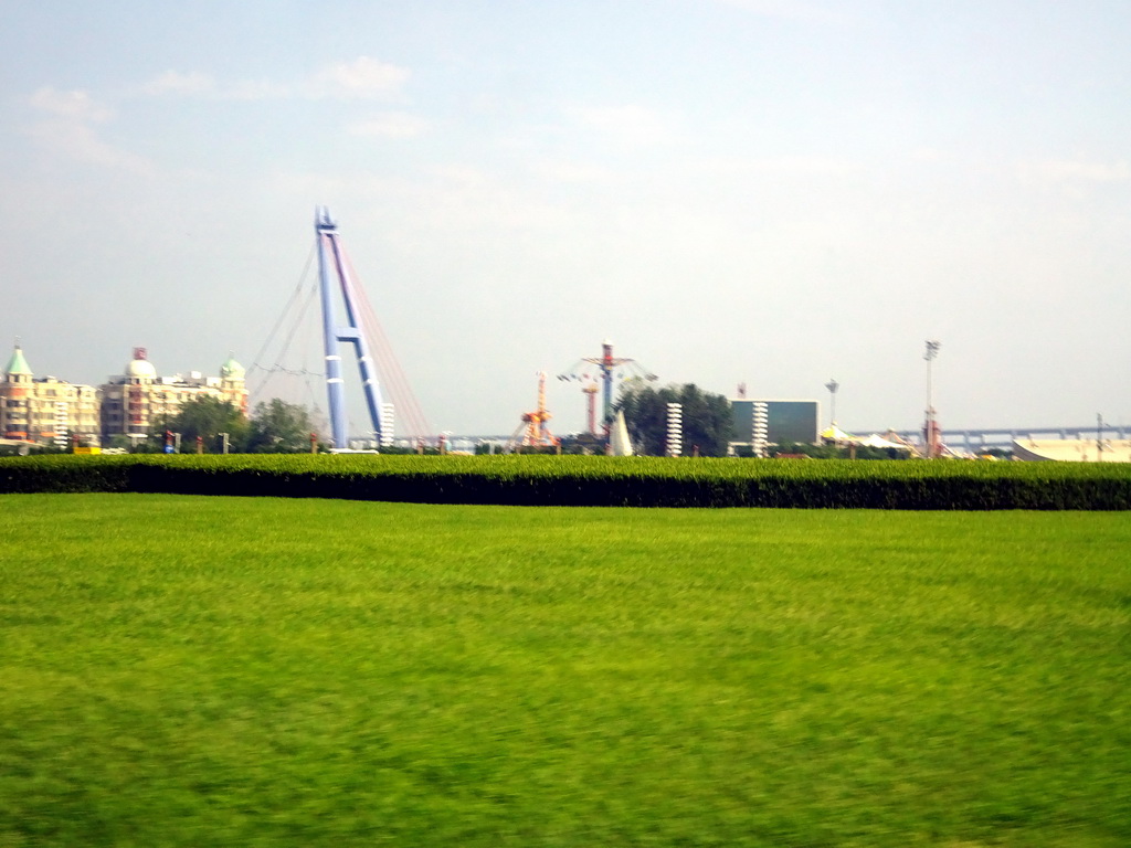 Xinghai Square and the Xinghai Square Recreation Ground at the southeast side, viewed from the taxi on the west side