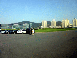 Xinghai Square with the Dalian World Expo Center and skyscrapers at the east side, viewed from the taxi on the west side
