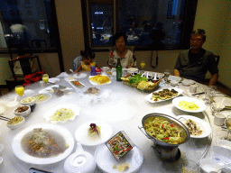 Miaomiao`s family having dinner at the restaurant of the New Sea View International Hotel