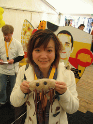 Miaomiao in the BIOPOP tent, with a plush giant microbe