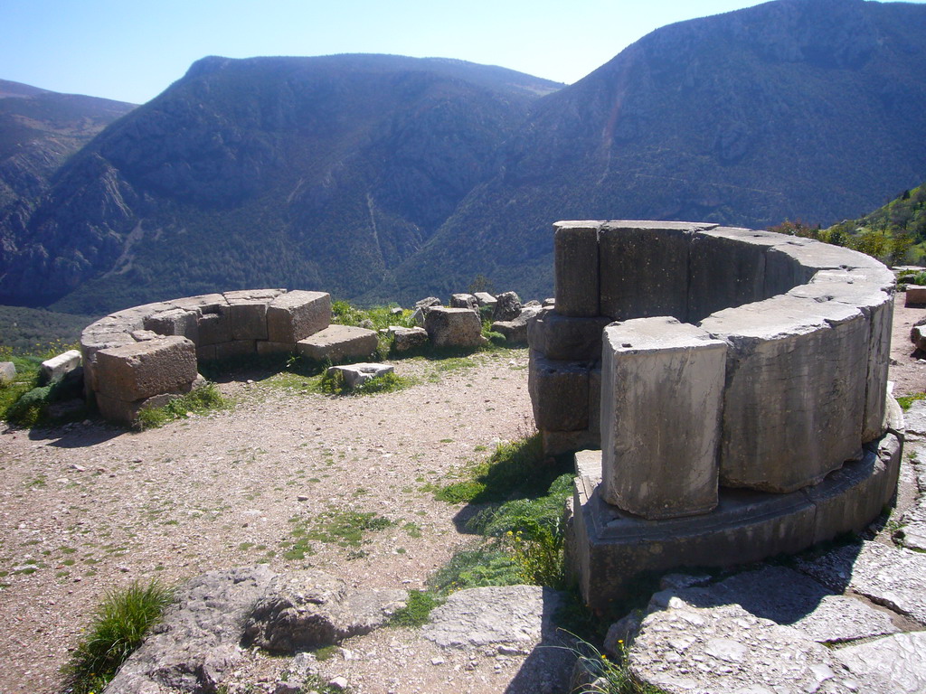Remnants of two half-circle shaped walls alongside the Sacred Way
